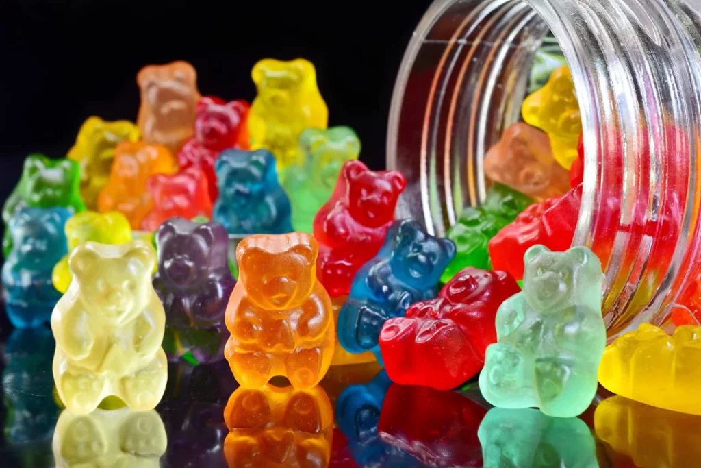 bear shape gummies out of glass jars.