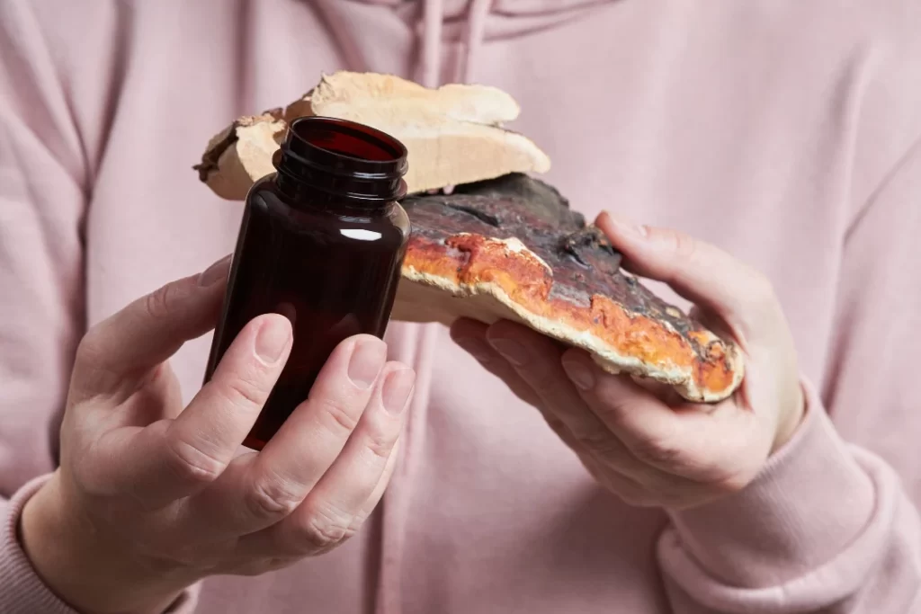 woman holding mushroom medicine and Mushrooms For Social Anxiety