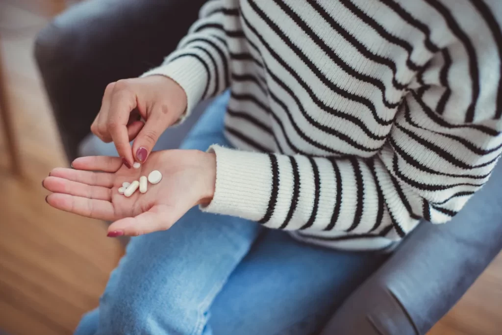 woman intaking Chaga mushroom supplement