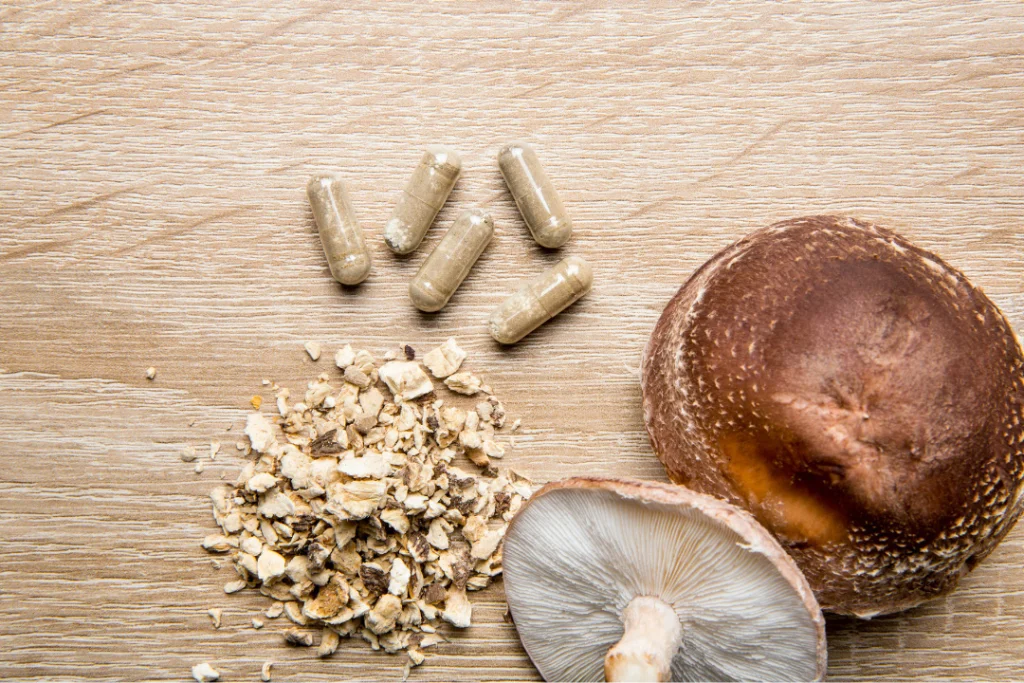 Mushrooms capsules along with grounded mushroom. 