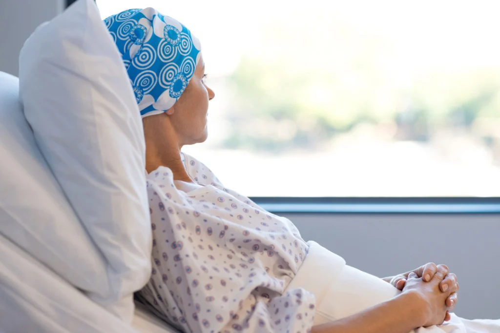 young woman on bed suffering for cancer