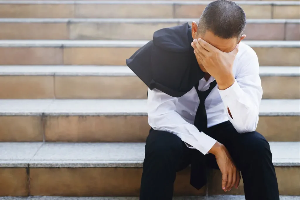 stress man sitting on stairs